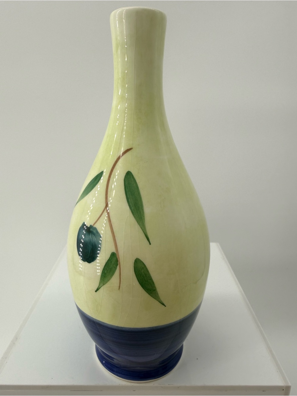 Handcrafted Cream Ceramic Vase with Blue Base and Leaf Motif